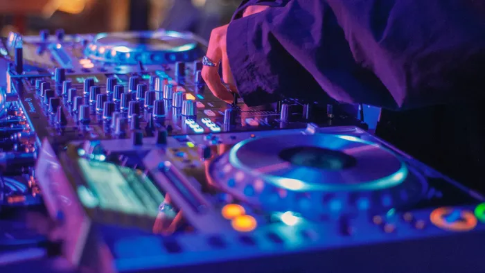 Close-up of a deejay operating digital turntables
